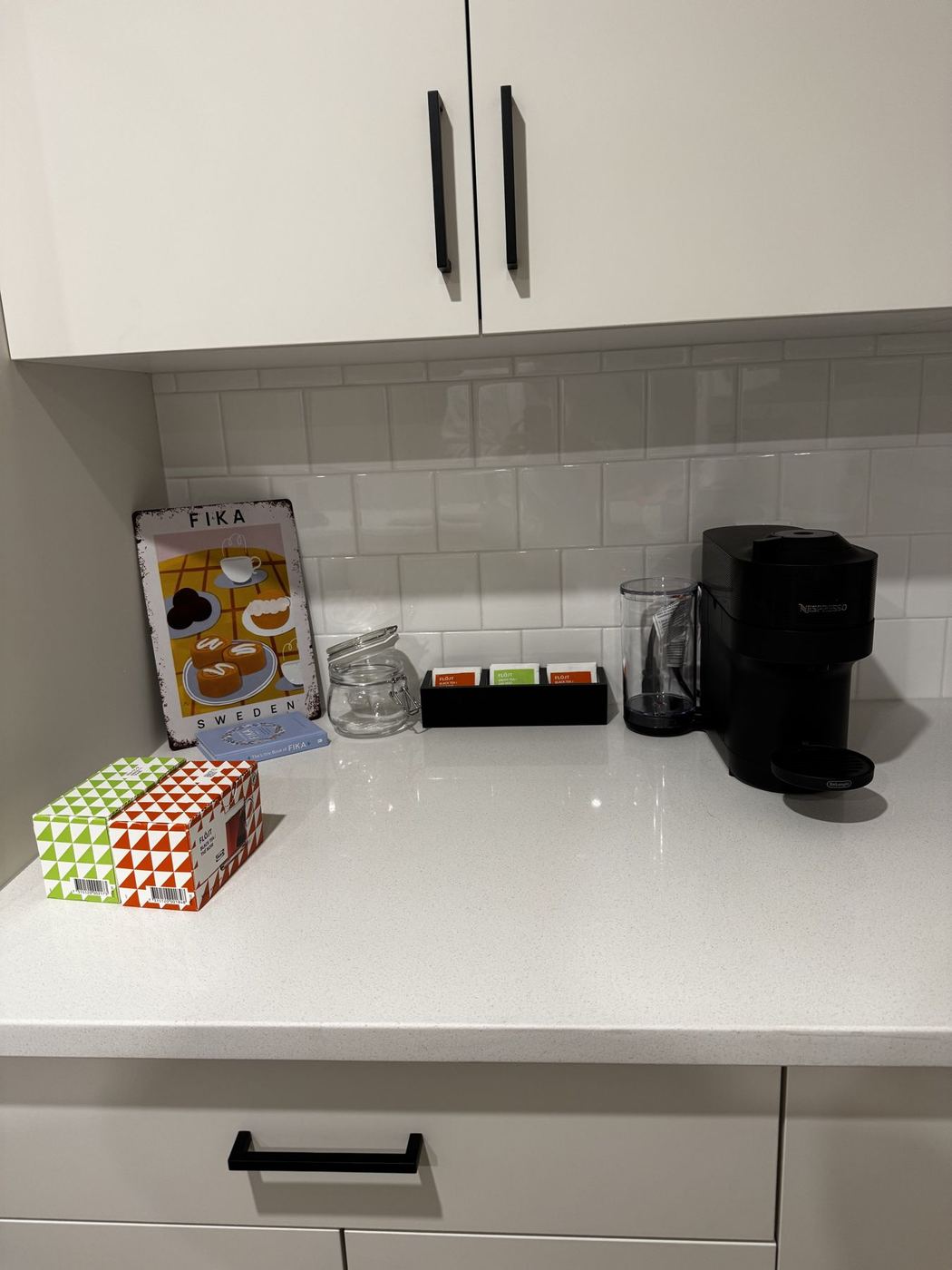 The Fika station: coffee machine and treat tin